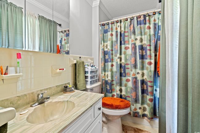Carpeted home office with crown molding | Image 27