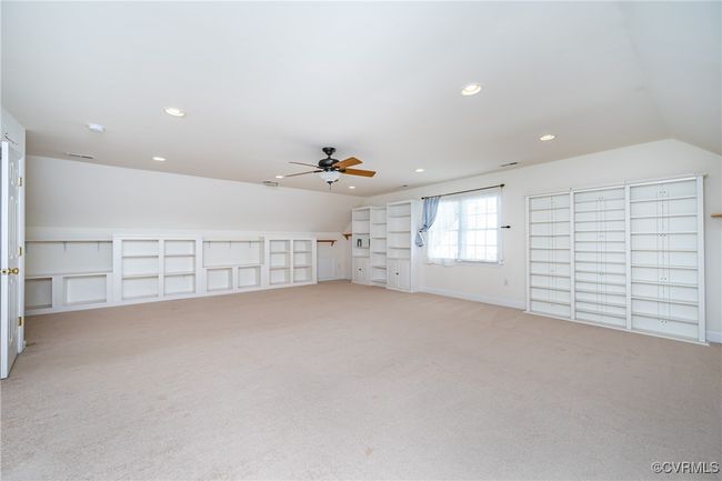 Bonus room featuring light carpet, ceiling fan, recessed lighting, and vaulted ceiling | Image 31