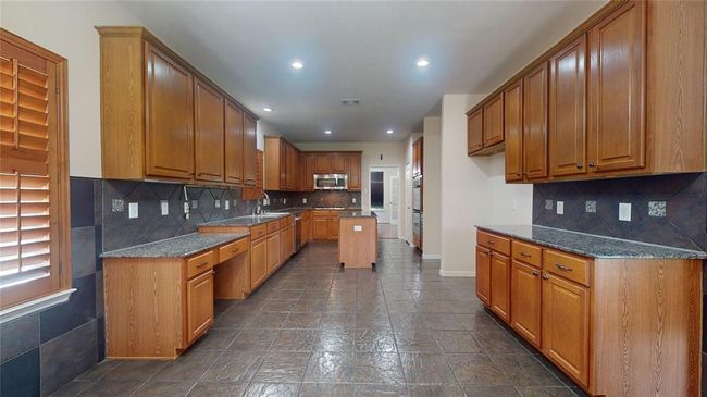 Chef's dream kitchen with sleek design and ample counter space. | Image 9