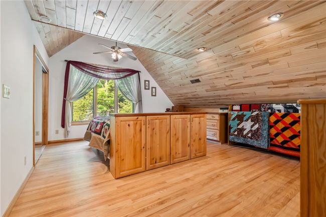 Upper Level bedroom with beautiful windows and ensuite bathroom with jetted jacuzzi tub and shower | Image 19