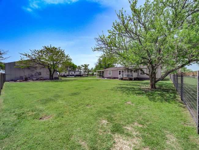 View of yard with fence | Image 33