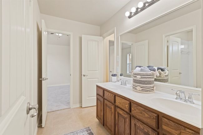 Bathroom featuring double vanity and tile patterned flooring | Image 26