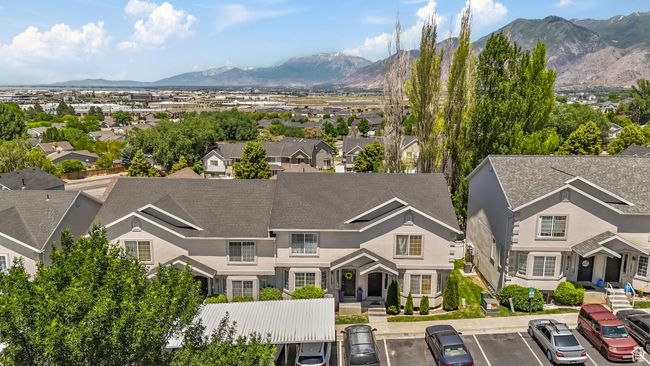 Aerial view of residential area featuring a mountainous background | Image 26
