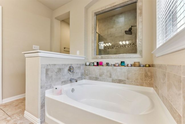 Unwind in the deep soaking tub—your own private escape designed for comfort and calm | Image 19