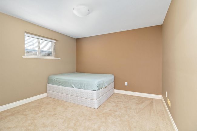 Carpeted bedroom featuring baseboards | Image 7