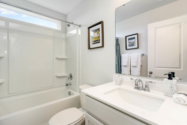 Bathroom with vanity and tub / shower combination | Image 27