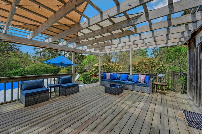 Deck featuring an outdoor living space and a pergola | Image 15