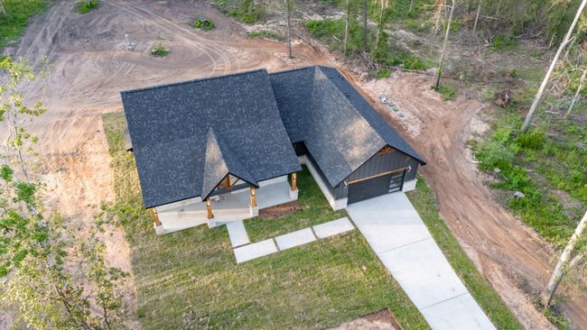 A view of the rear clearing and freshly graded soil, perfect for a future patio, workshop, garden, or pool—customize the backyard oasis of your dreams. | Image 42