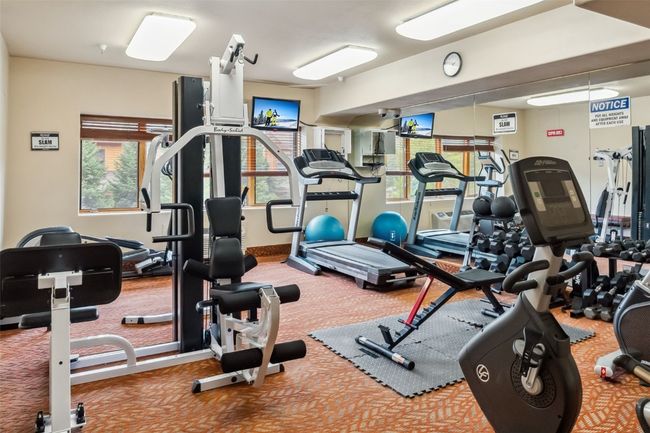 Fitness room with lots of equipment. | Image 15