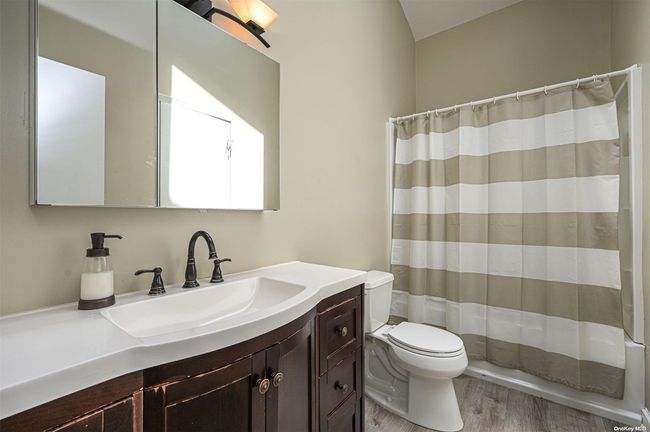 Unit 6 Full Bathroom w/ Skylight | Image 12
