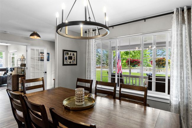 Dining room featuring plenty of natural light and a chandelier | Image 25