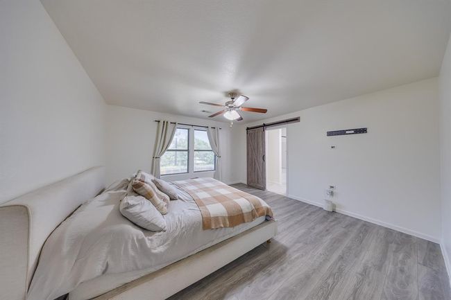 Primary bedroom located on the second floor certainly adds privacy. | Image 22