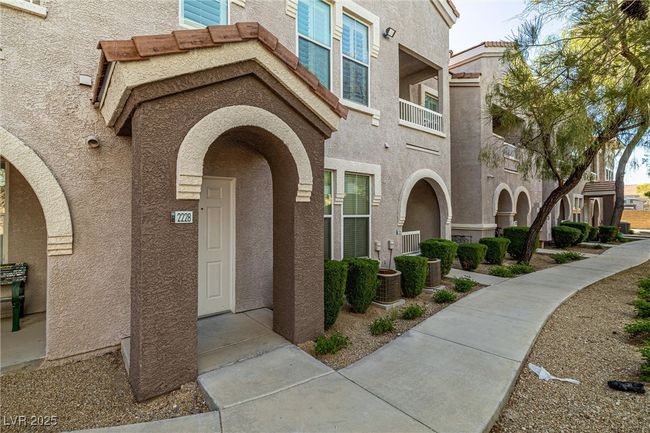 View of exterior entry with stucco siding | Image 5