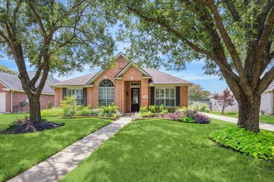 Welcome to 1314 Ragsdale Lane!Welcome to this stunning home that features four bedrooms and two and a half bathrooms, situated in the desirable Cinco Ranch master Planned Community. Spanning an impressive 2, 484 square feet, this property is truly a standout gem! | Image 1