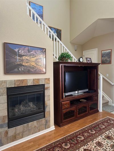 Open living room with vaulted ceiling and open stairs | Image 3