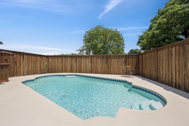 Not only is the pool totally amazing, but don't miss the high-end wood fence - so professionally installed - provides the safety for the pool area and the privacy, too! | Image 25