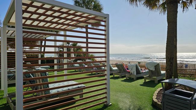 Exterior space featuring a water view and a view of the beach | Image 26