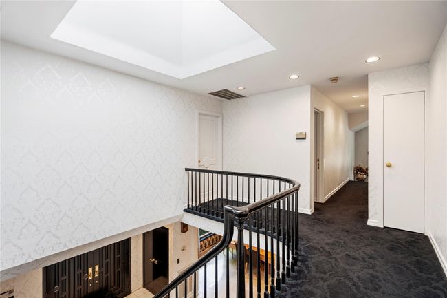 Hall with an upstairs landing, carpet floors, baseboards, and recessed lighting | Image 12