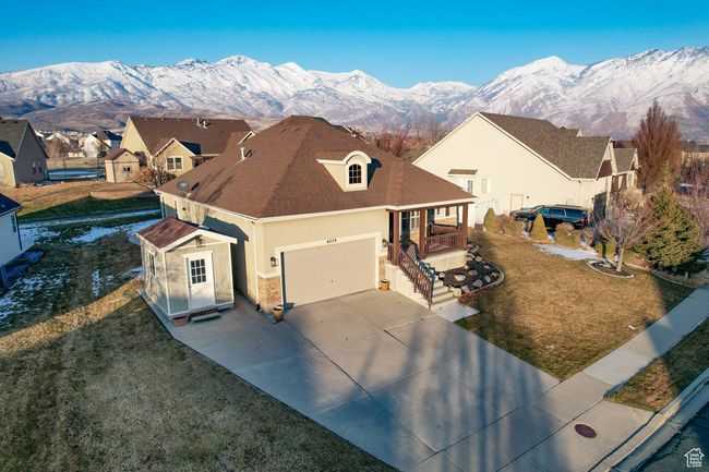 View of front of property featuring a front yard, a porch, and a mountain view | Image 45
