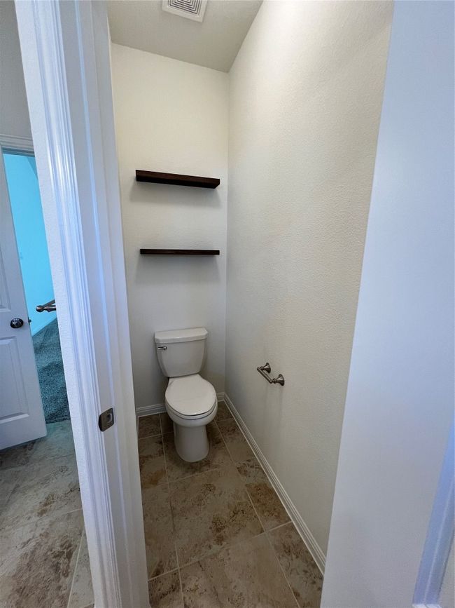 Bathroom with toilet and baseboards | Image 32