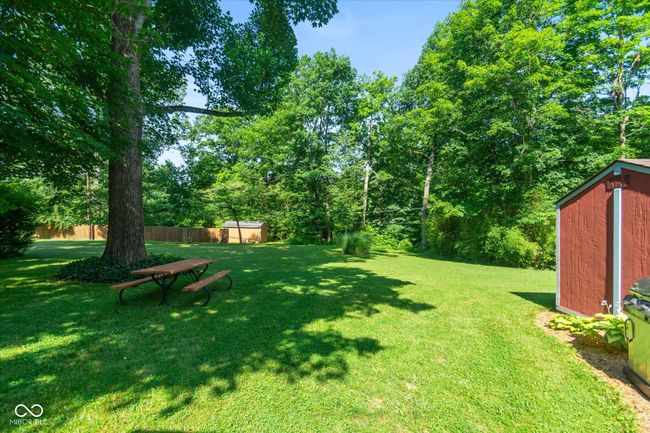 view of yard featuring a storage shed | Image 23