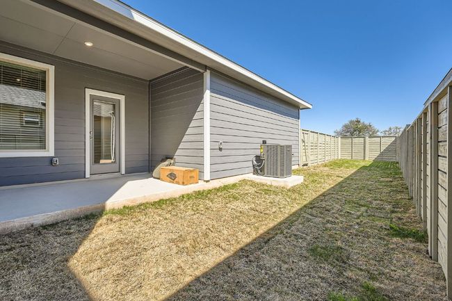 View of yard featuring a patio area, central air condition unit, and a fenced backyard | Image 25
