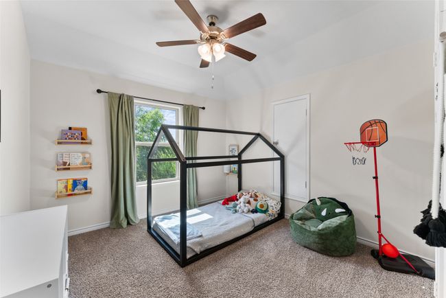 Carpeted bedroom with baseboards and a ceiling fan | Image 23