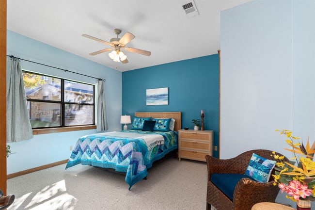 Bedroom with ceiling fan and carpet | Image 20