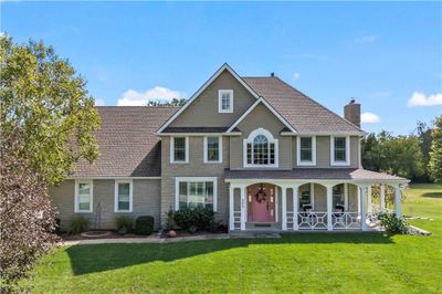 View of front of home with a porch and a front yard | Image 2