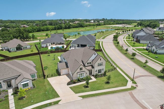 Aerial view of residential area with a large body of water | Image 31