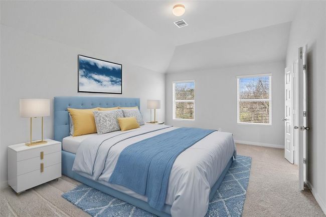 Come and unwind after a long day in this magnificent primary suite! This spacious room features plush carpet, warm paint, high ceilings, and large windows with blinds! | Image 8