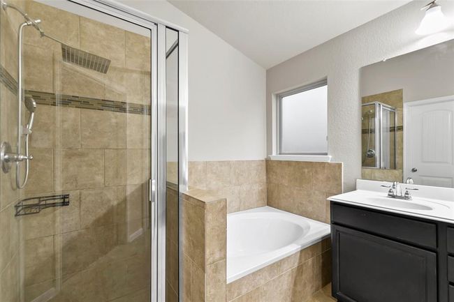 Dual sinks, soaking tub and separate shower in primary bath | Image 24