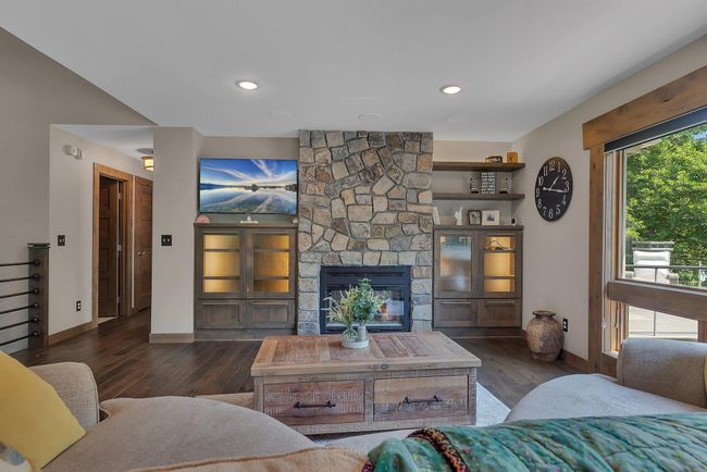 Fireplace warmth meets lakeside serenity. | Image 15