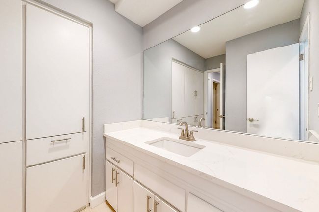 Bathroom on first floor with lots of cabinets | Image 10