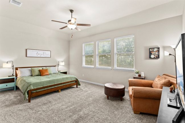 Carpeted bedroom featuring baseboards and a ceiling fan | Image 13