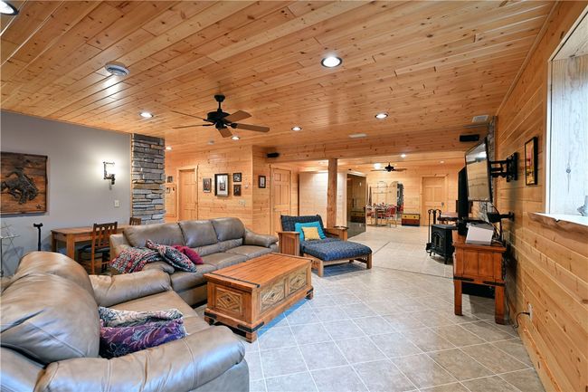 Lower level family room with sauna and free-standing fireplace | Image 28