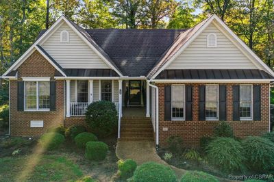 Bungalow-style home featuring a porch | Image 1