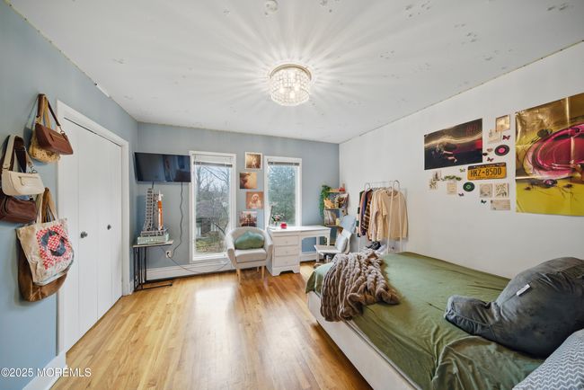 Bedroom #3, large windows, hardwood floors & custom closets! | Image 30