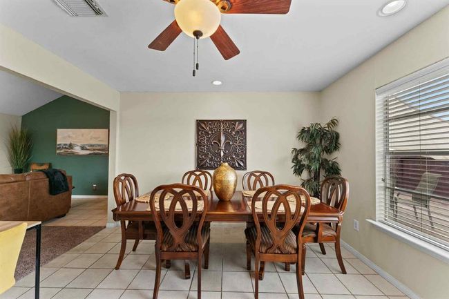 This bright and roomy dining area offers the perfect spot to gather, dine, and make memories around the table. | Image 9