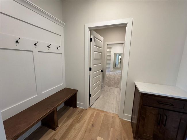 Mudroom with light wood-style flooring and baseboards | Image 45
