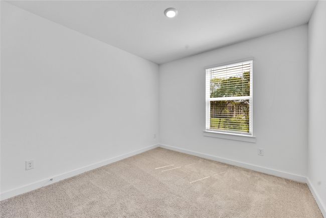 Unfurnished room featuring light colored carpet and baseboards | Image 22