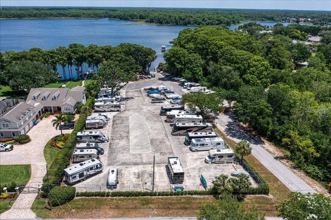 Amenities include free RV or boat storage in a secure lot with a boat ramp~ | Image 45
