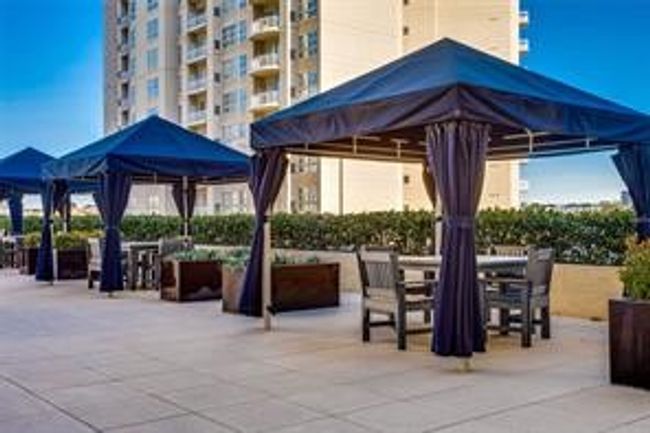 Terrific patio featuring an outdoor living space with a fire pit | Image 21