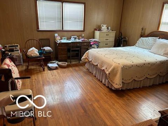 bedroom featuring wood finished floors | Image 6