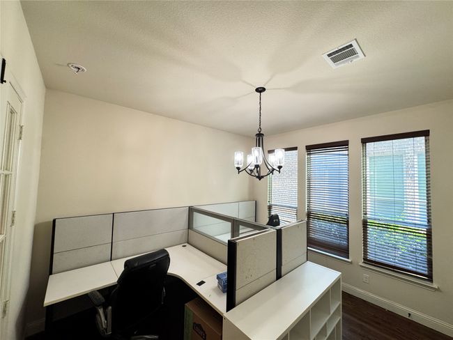office room downstairs with a closet | Image 15