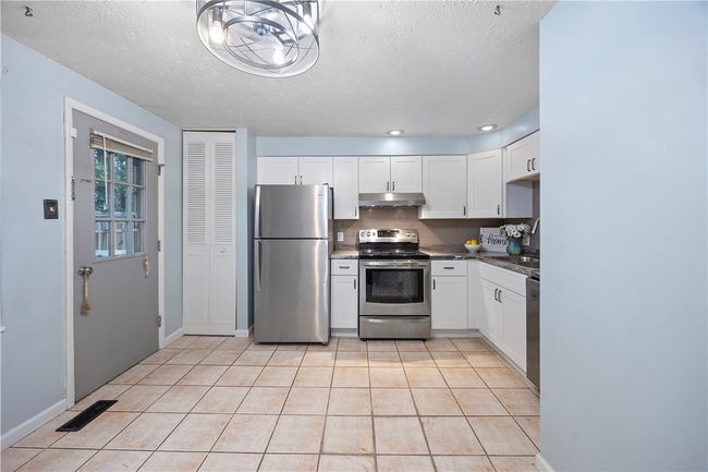 Step right outside to your deck from the kitchen | Image 16