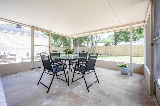 Sun room and uncovered patio. | Image 16