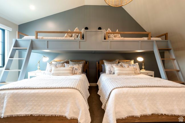 Bedroom featuring lofted ceiling | Image 50