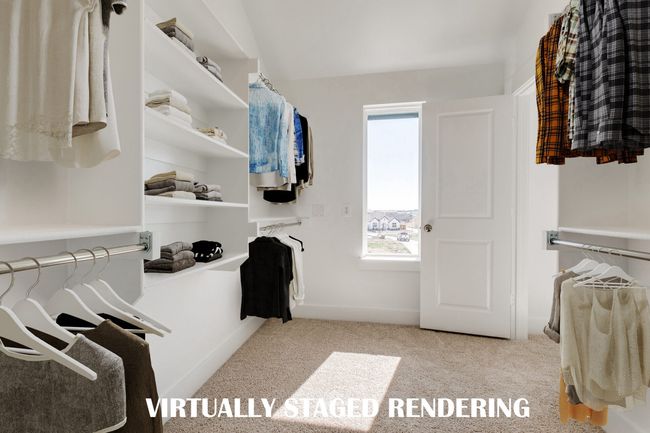 You'll find a wonderful owners closet filled with natural light in our Bella plan. VIRTUALLY STAGED RENDERING | Image 13