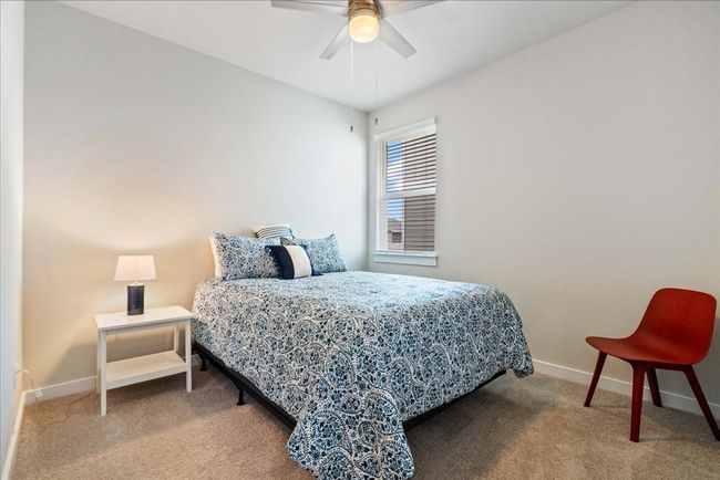 Bedroom with carpet floors and a ceiling fan | Image 16